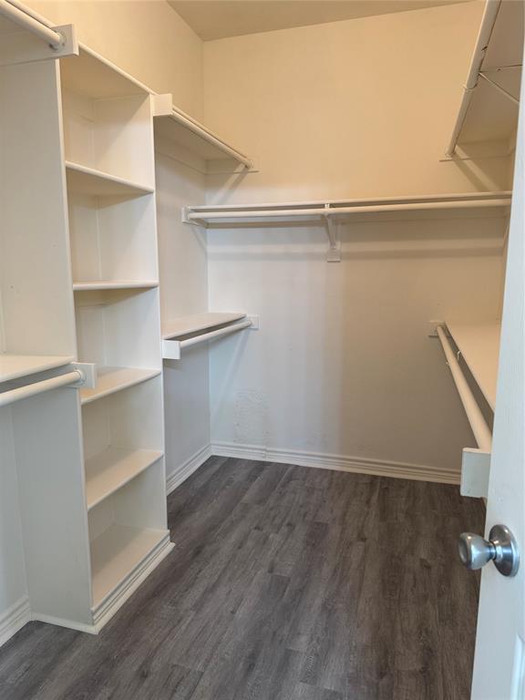 5817 Mulvane Drive Plano, TX 75094 - Photo 28 of 39 a view of walk in closet with empty racks