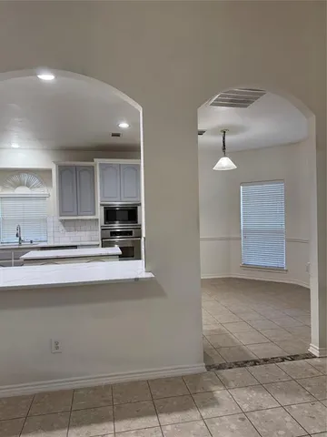 a view of kitchen with cabinets and outdoor space