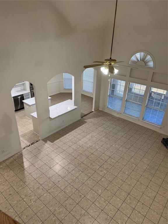 5817 Mulvane Drive Plano, TX 75094 - Photo 37 of 39 a view of a room with furniture and a chandelier fan