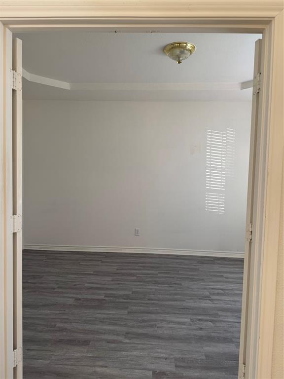 5817 Mulvane Drive Plano, TX 75094 - Photo 8 of 39 a view of room with wooden floor