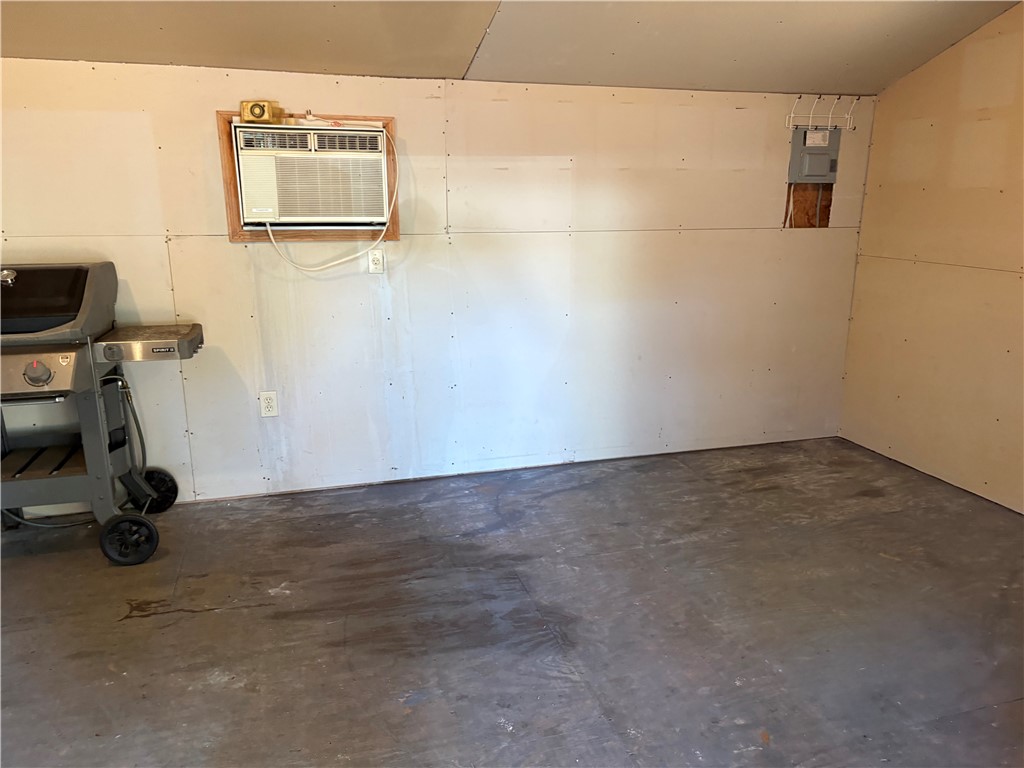306 Hemlock Avenue Anderson, SC 29625 - Photo 25 of 25 An unfinished utility space features drywall paneling and concrete flooring.