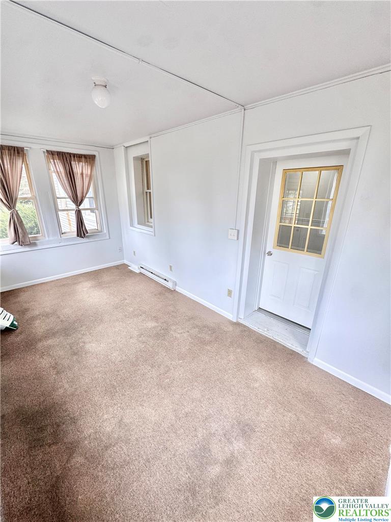 8361 Schantz Road, Unit 1 Breinigsville, PA 18031 - Photo 2 of 18 an empty room with windows and closet
