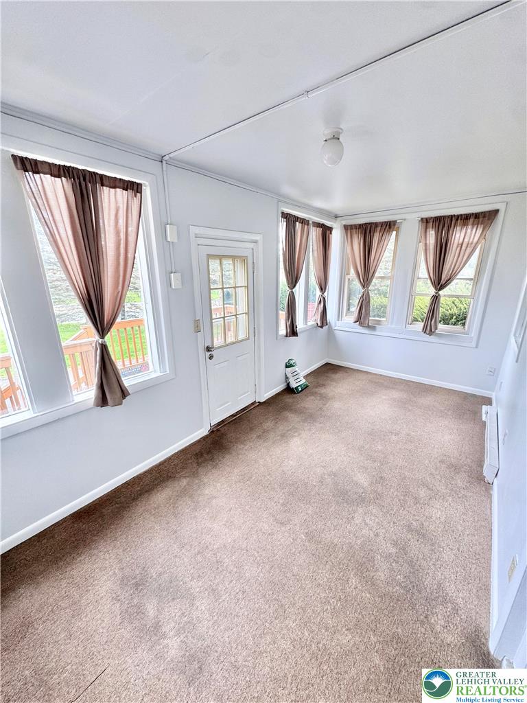 8361 Schantz Road, Unit 1 Breinigsville, PA 18031 - Photo 3 of 18 an empty room with windows