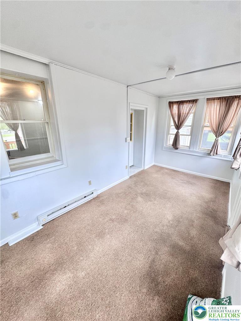 8361 Schantz Road, Unit 1 Breinigsville, PA 18031 - Photo 4 of 18 a view of an empty room with a window