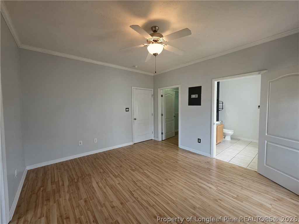 1324 Kershaw Loop, Unit 206 Fayetteville, NC 28314 - Photo 12 of 26 an empty room with wooden floor and ceiling fan