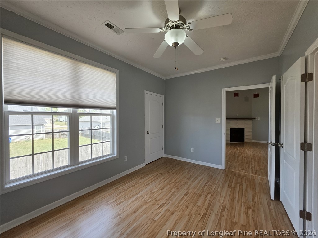 1324 Kershaw Loop, Unit 206 Fayetteville, NC 28314 - Photo 14 of 26 wooden floor in an empty room with a window
