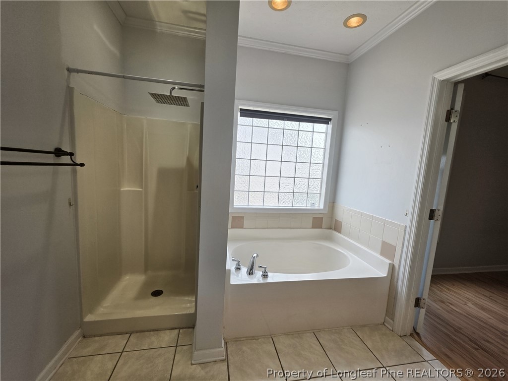 1324 Kershaw Loop, Unit 206 Fayetteville, NC 28314 - Photo 18 of 26 a bathroom with a bathtub and shower