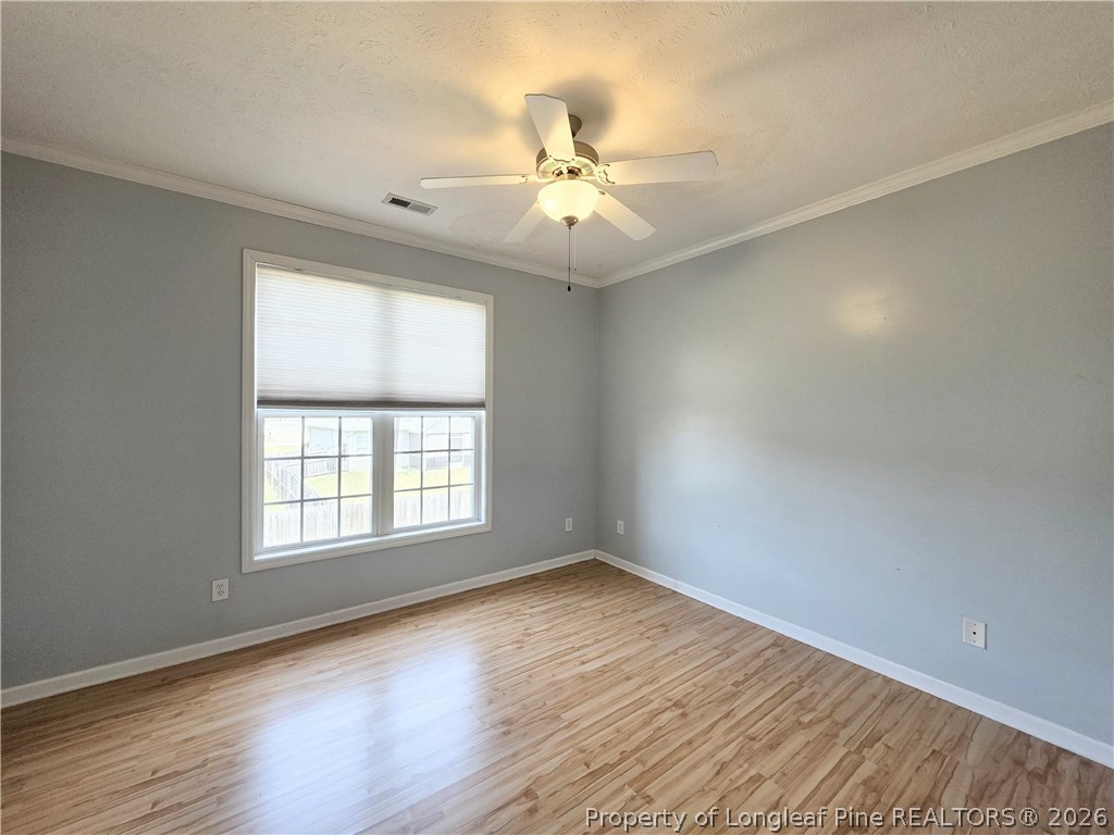 1324 Kershaw Loop, Unit 206 Fayetteville, NC 28314 - Photo 19 of 26 wooden floor in an empty room with a window