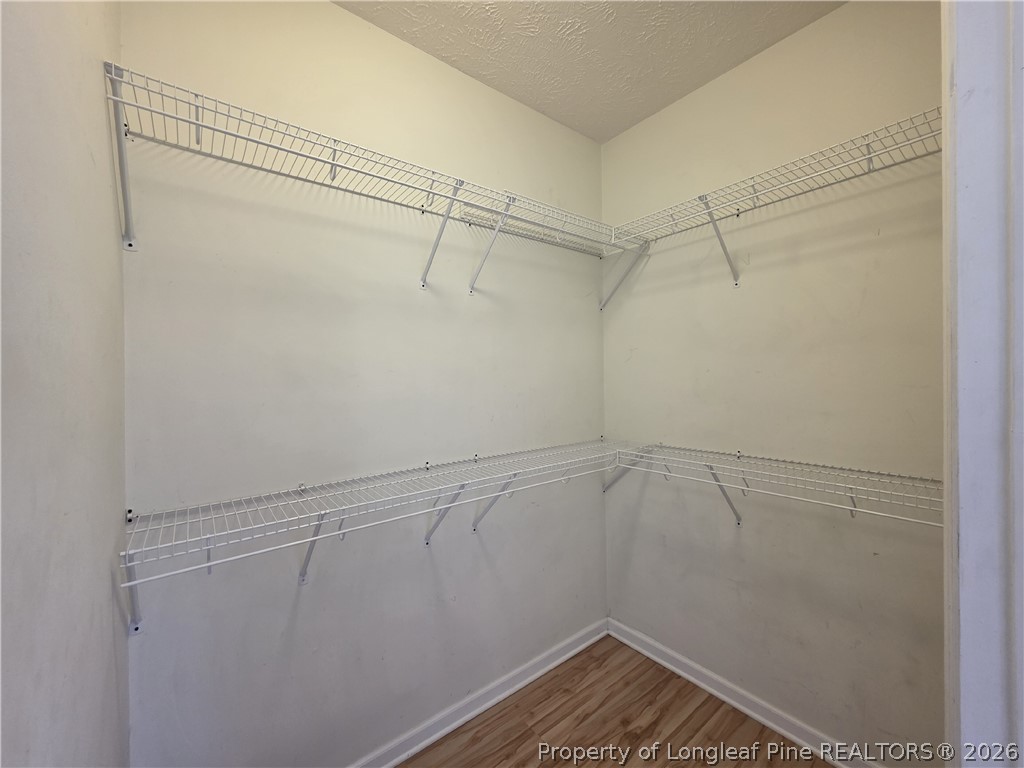 1324 Kershaw Loop, Unit 206 Fayetteville, NC 28314 - Photo 21 of 26 a view of a room with racks on the wall
