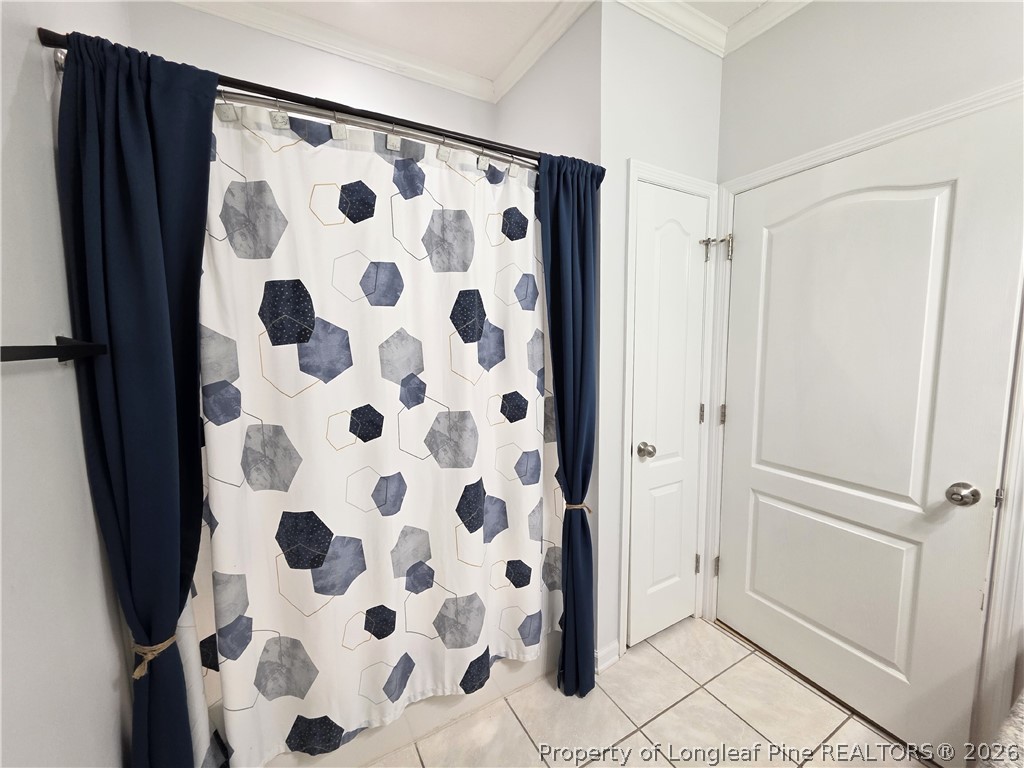 1324 Kershaw Loop, Unit 206 Fayetteville, NC 28314 - Photo 23 of 26 a view of bathroom with a shower and a mirror