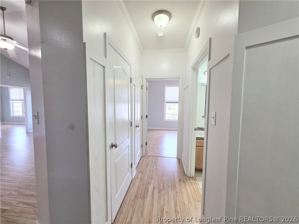 1324 Kershaw Loop, Unit 206 Fayetteville, NC 28314 - Photo 4 of 26 a view of a hallway with wooden floor