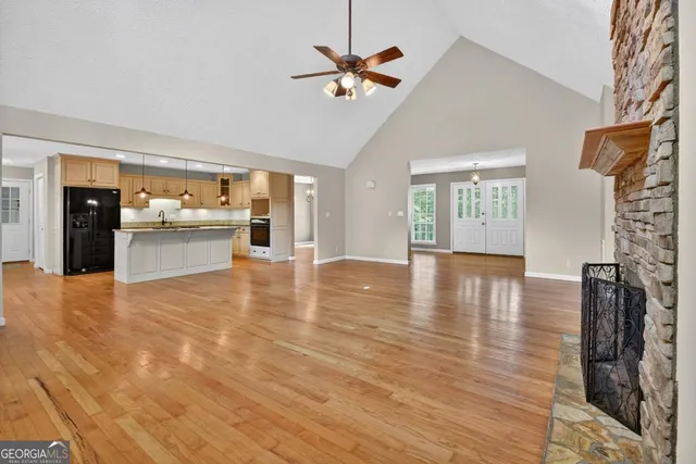 a kitchen with white cabinets and appliances