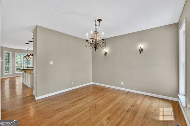 a view of a bathroom with a sink and mirror
