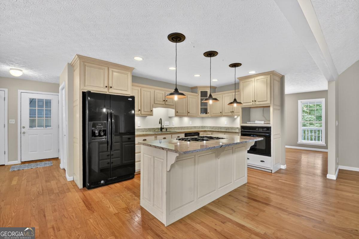 344 Cascade Lane Blue Ridge, GA 30513 - Photo 31 of 62 a kitchen with stainless steel appliances granite countertop a refrigerator a stove a sink and a oven