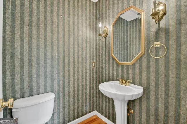 a bathroom with a sink a mirror and a shower