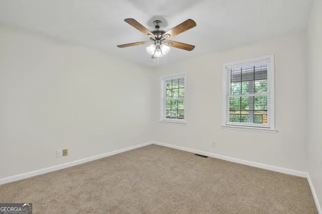 a bathroom with a shower and a door