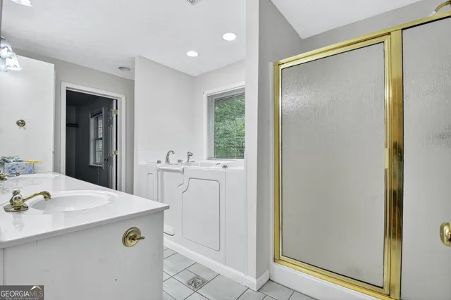 an empty room with chandelier fan