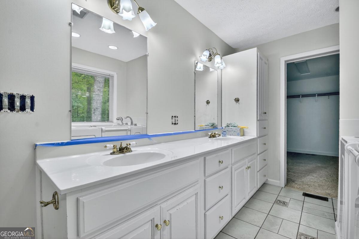 344 Cascade Lane Blue Ridge, GA 30513 - Photo 46 of 62 a bathroom with a sink vanity and a mirror