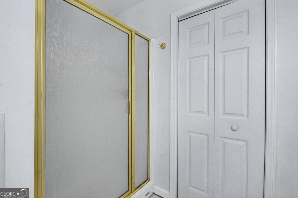 344 Cascade Lane Blue Ridge, GA 30513 - Photo 48 of 62 a bathroom with a shower and a door