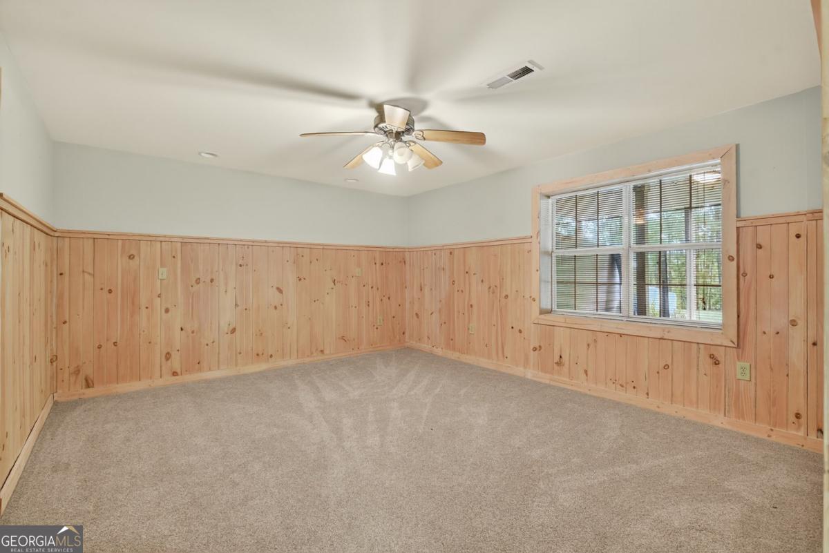 344 Cascade Lane Blue Ridge, GA 30513 - Photo 54 of 62 an empty room with chandelier fan
