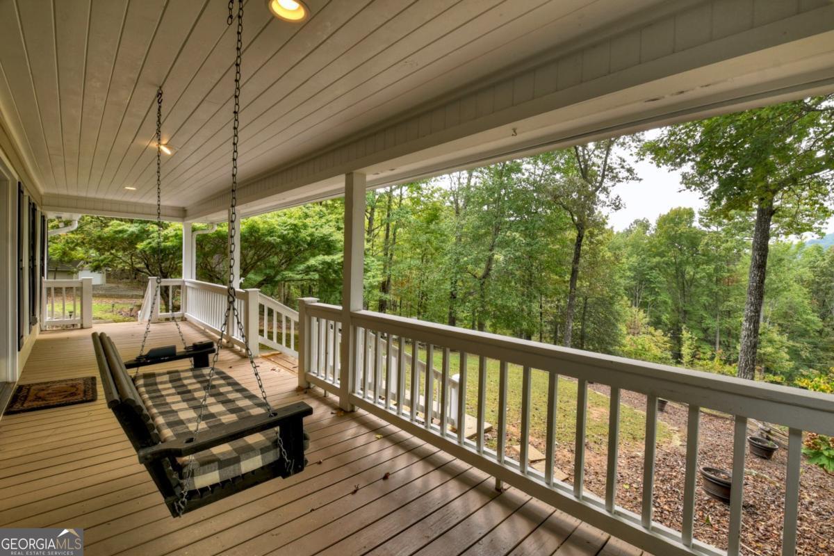 344 Cascade Lane Blue Ridge, GA 30513 - Photo 8 of 62 a view of a two chairs in the balcony next to a yard