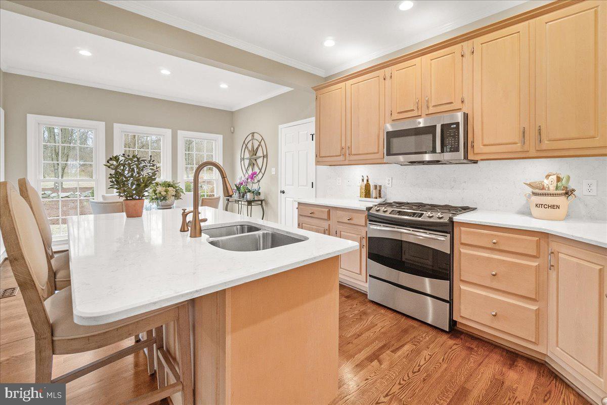 8029 Ridge Road Frederick, MD 21702 - Photo 29 of 91 a kitchen with stainless steel appliances granite countertop a sink stove and microwave