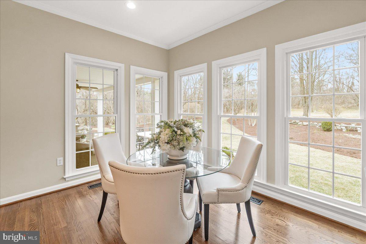 8029 Ridge Road Frederick, MD 21702 - Photo 33 of 91 a dining room with furniture window and wooden floor