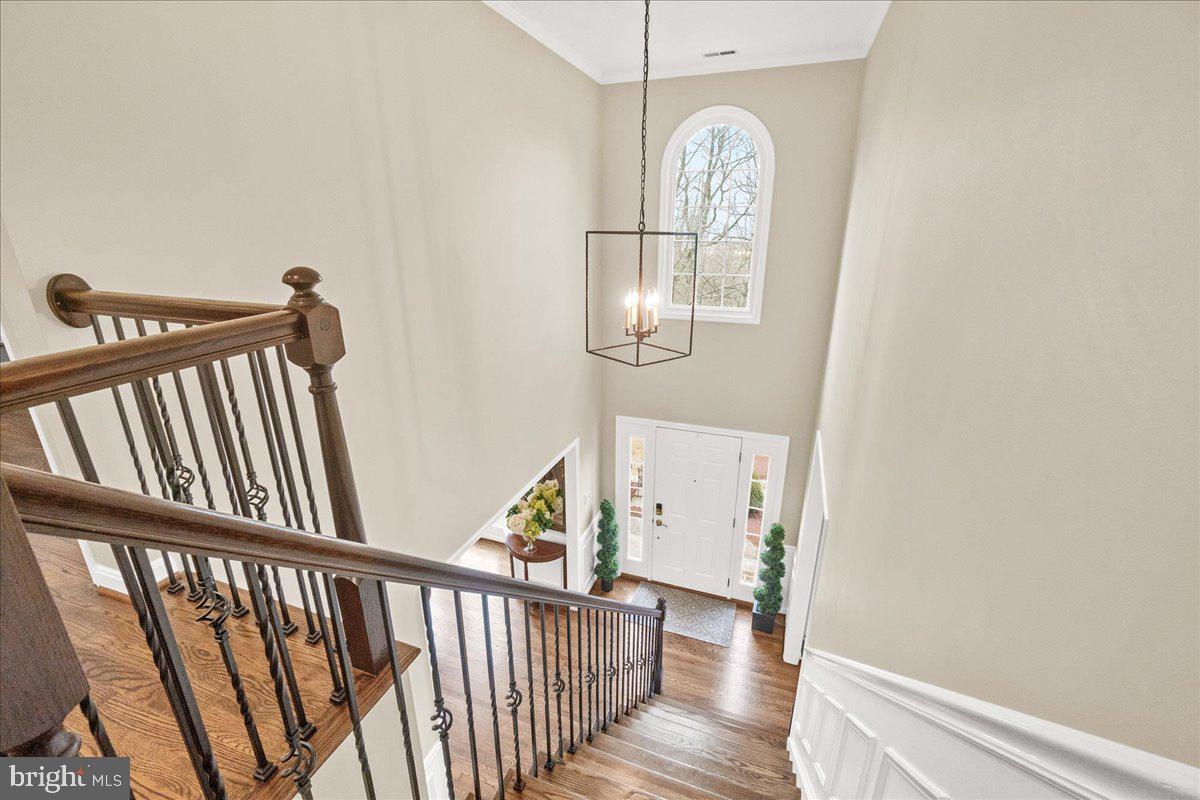 8029 Ridge Road Frederick, MD 21702 - Photo 37 of 91 a view of a hallway with wooden floor and windows