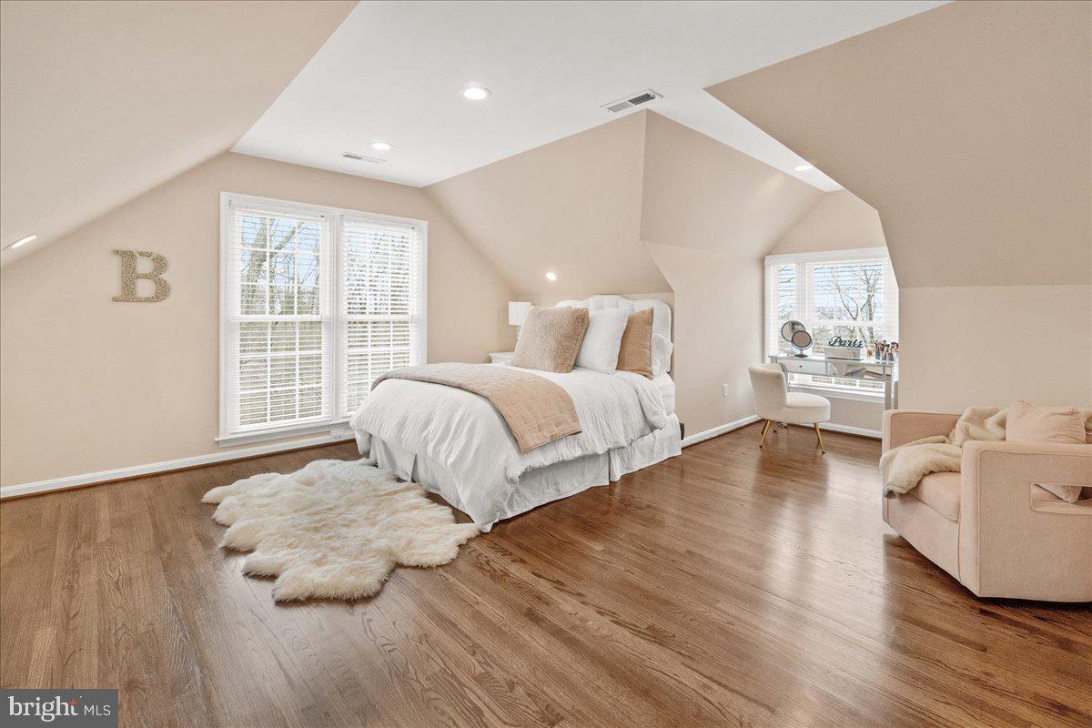 8029 Ridge Road Frederick, MD 21702 - Photo 39 of 91 a spacious bedroom with a bed and wooden floor