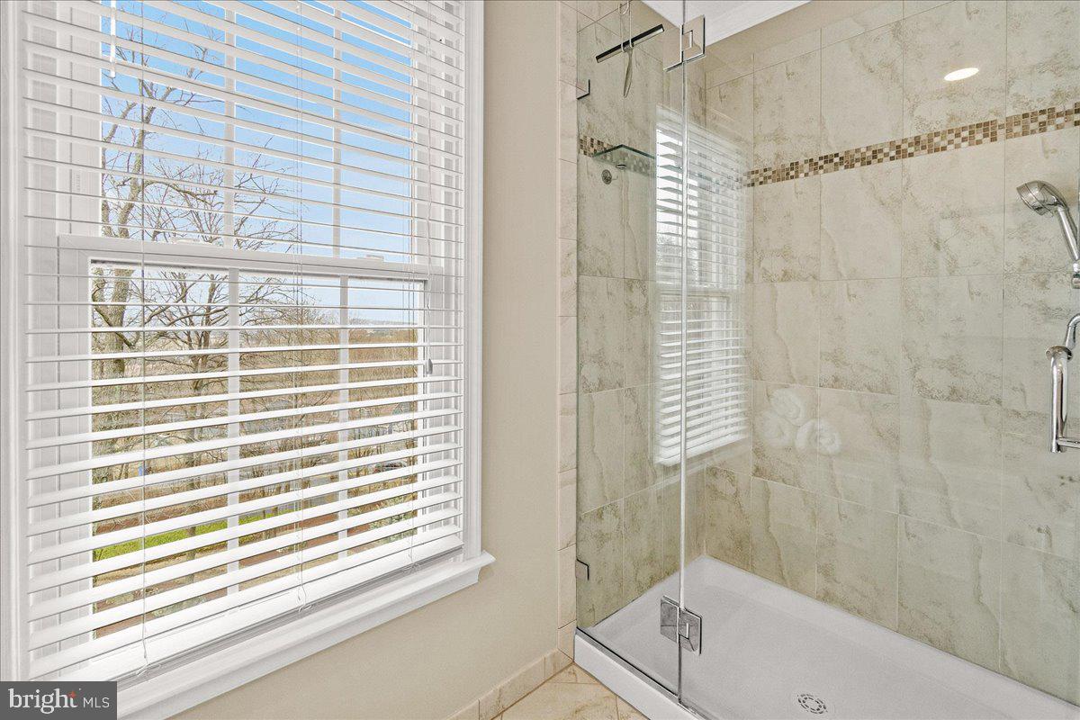 8029 Ridge Road Frederick, MD 21702 - Photo 48 of 91 a bathroom with a window and a shower