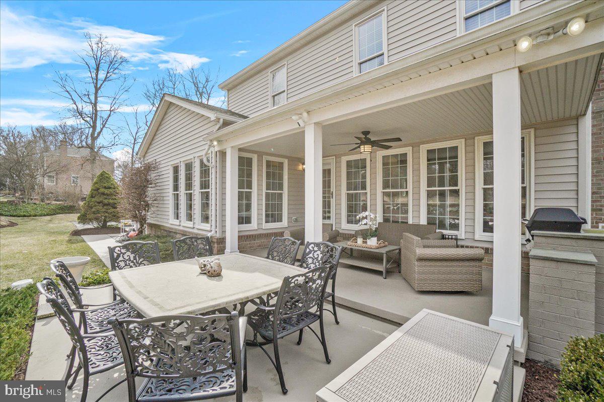 8029 Ridge Road Frederick, MD 21702 - Photo 61 of 91 a view of a patio with table and chairs and potted plants