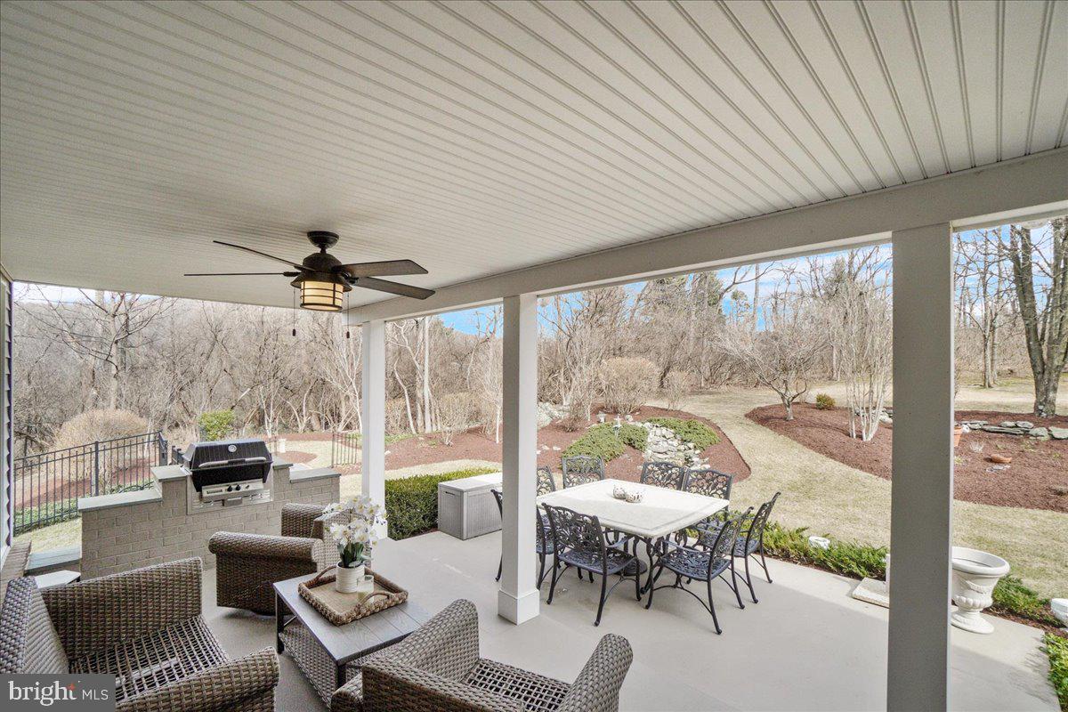 8029 Ridge Road Frederick, MD 21702 - Photo 62 of 91 a living room with furniture a ceiling fan and a large window