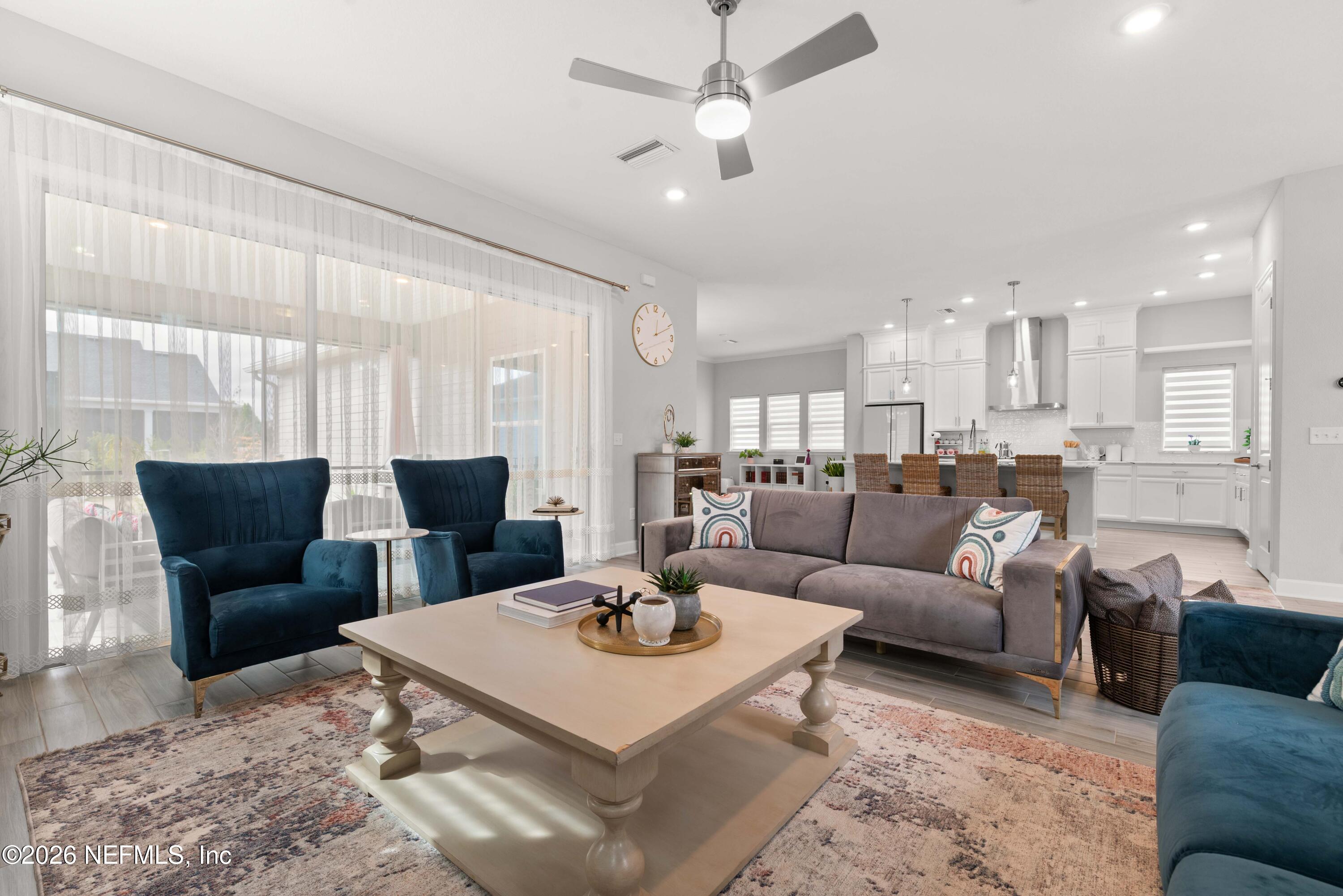 5270 Piney Flats Road Jacksonville, FL 32224 - Photo 13 of 53 a living room with furniture kitchen view and a chandelier
