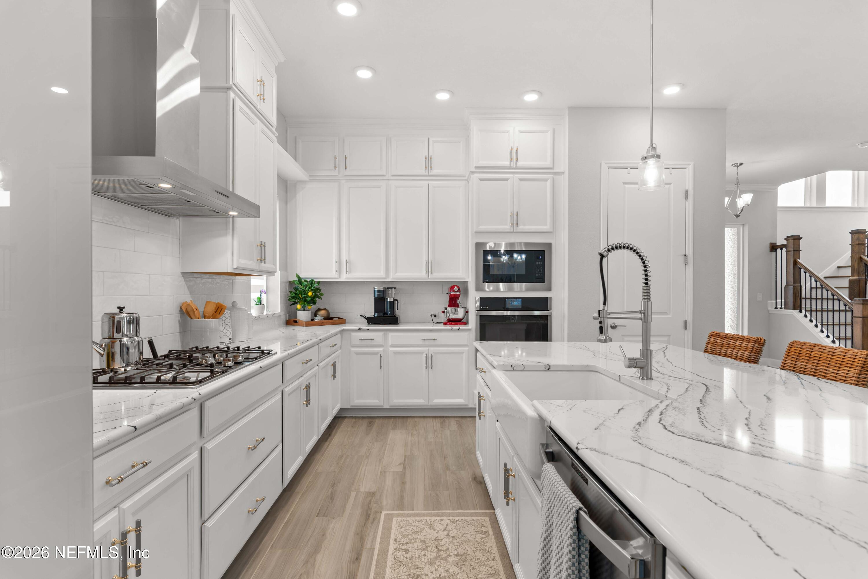 5270 Piney Flats Road Jacksonville, FL 32224 - Photo 16 of 53 a kitchen with a sink stove and cabinets