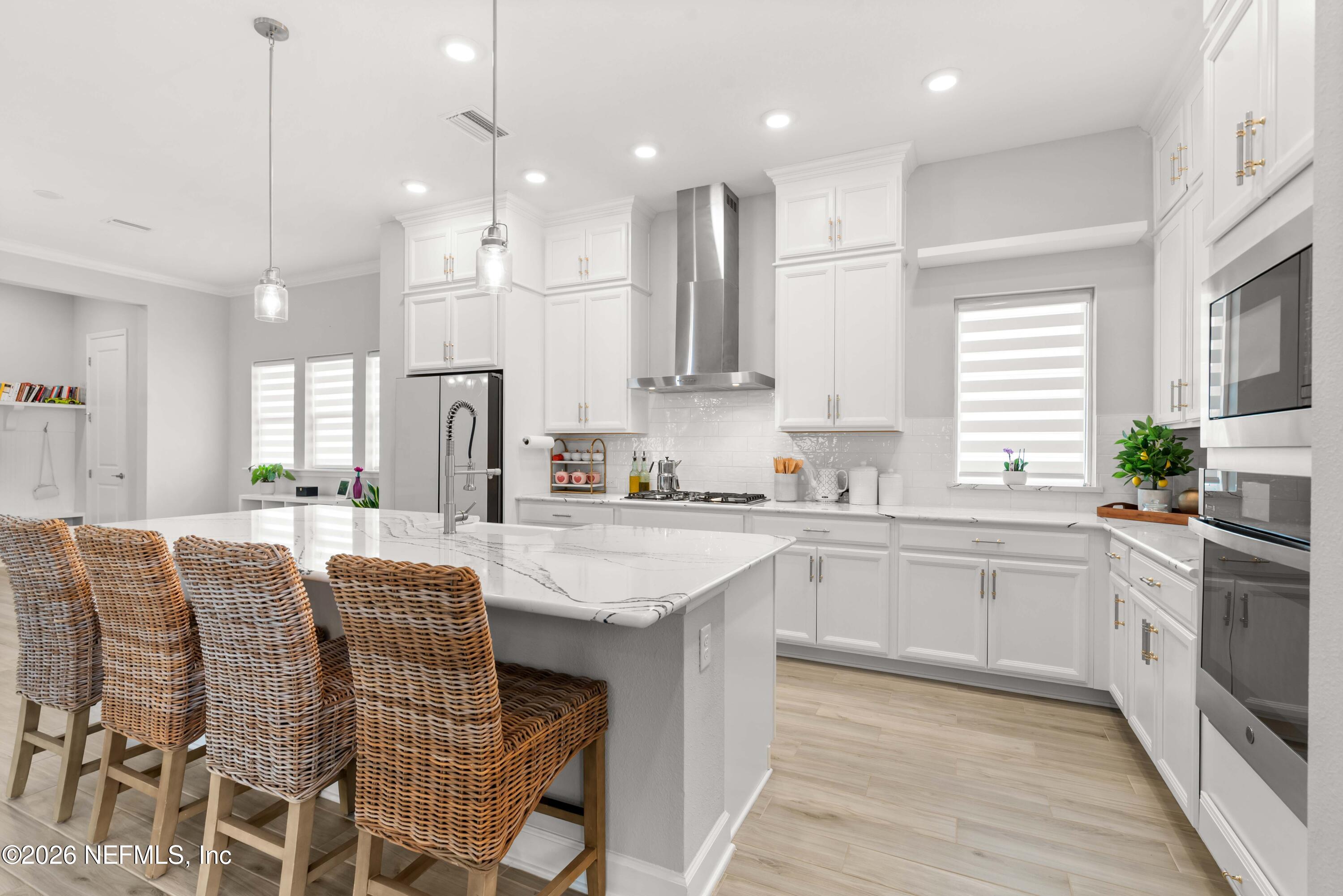 5270 Piney Flats Road Jacksonville, FL 32224 - Photo 18 of 53 a kitchen with stainless steel appliances granite countertop a kitchen island hardwood floor sink and stove