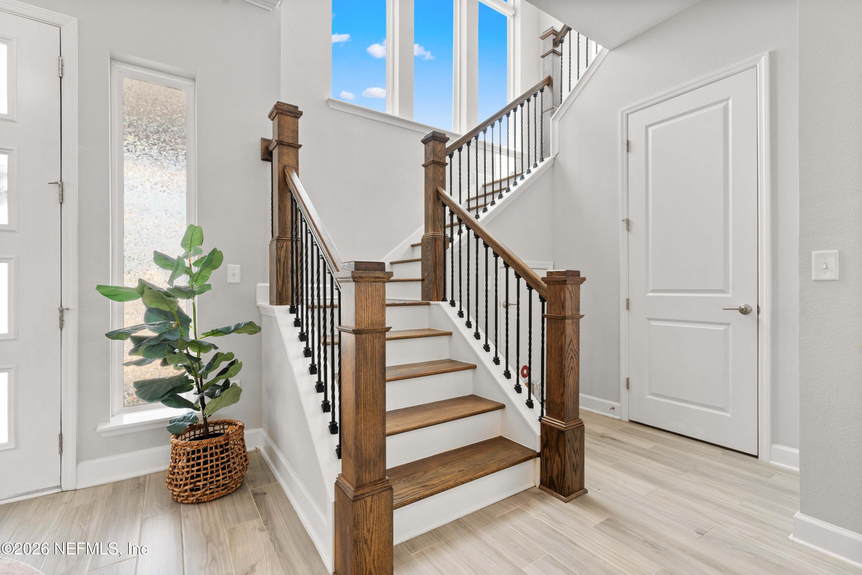 5270 Piney Flats Road Jacksonville, FL 32224 - Photo 24 of 53 a view of staircase with wooden floor and a potted plant