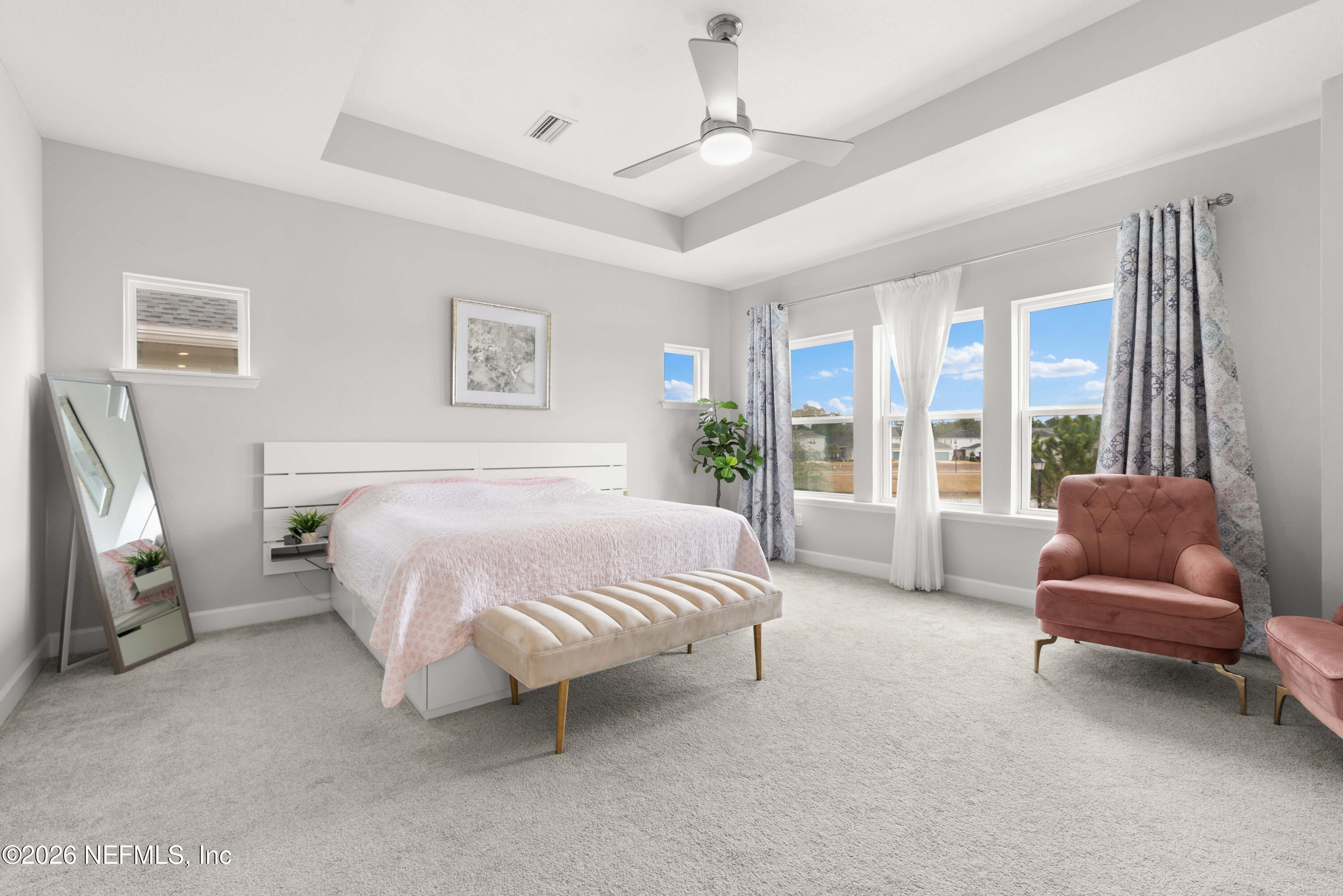 5270 Piney Flats Road Jacksonville, FL 32224 - Photo 28 of 53 a spacious bedroom with a bed and a couch