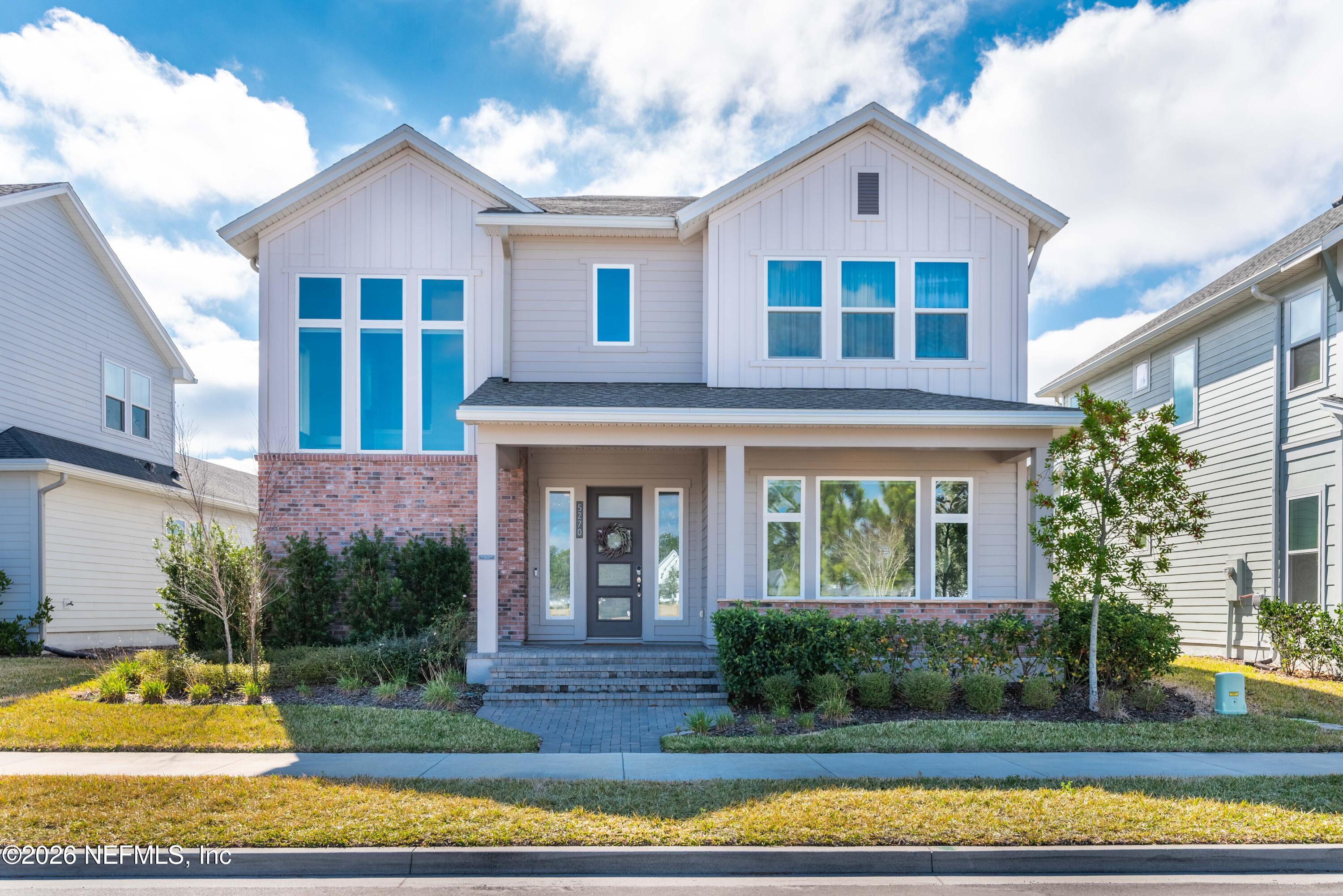 5270 Piney Flats Road Jacksonville, FL 32224 - Photo 3 of 53 a front view of a house with a yard