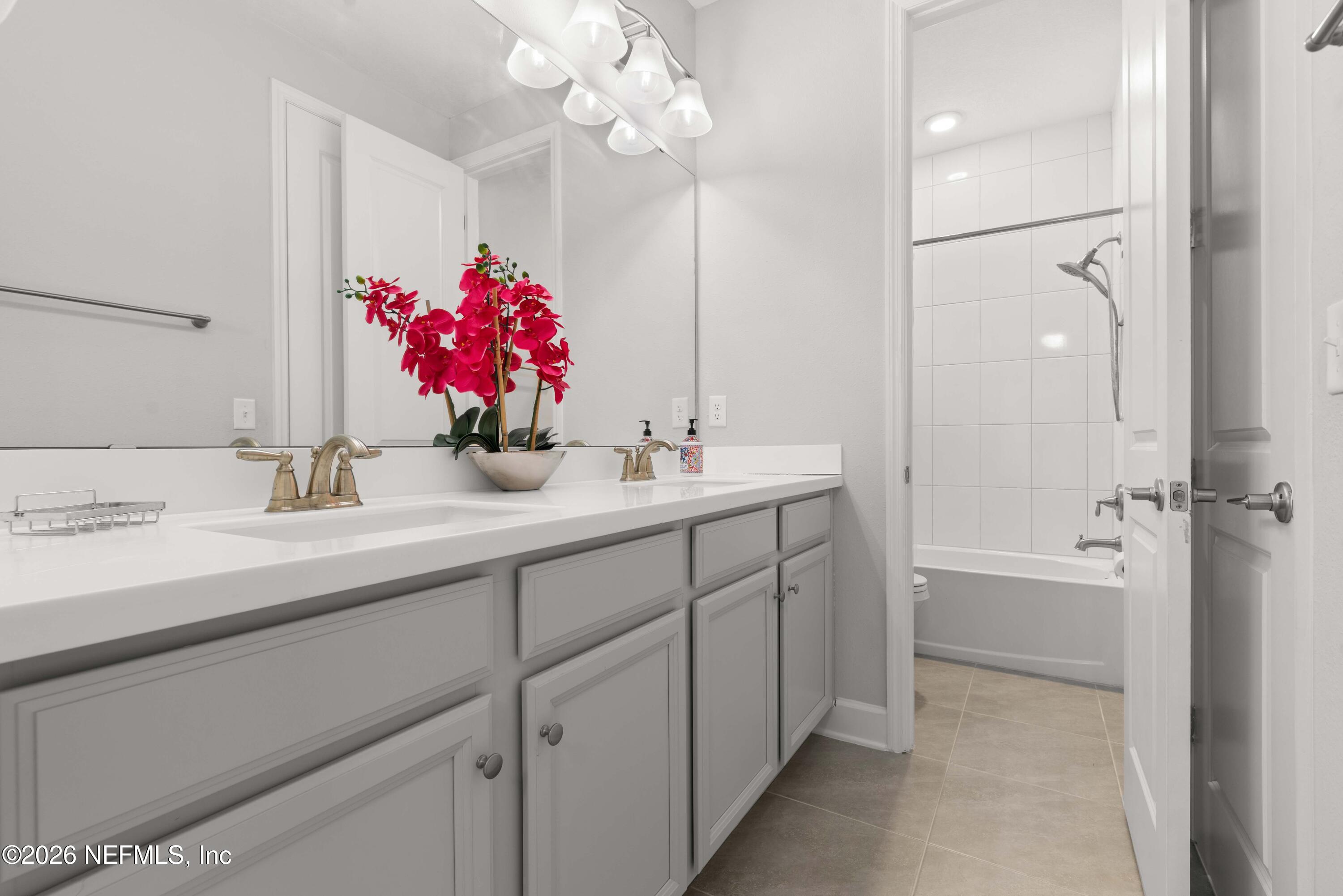 5270 Piney Flats Road Jacksonville, FL 32224 - Photo 31 of 53 a bathroom with a sink vanity tub and shower