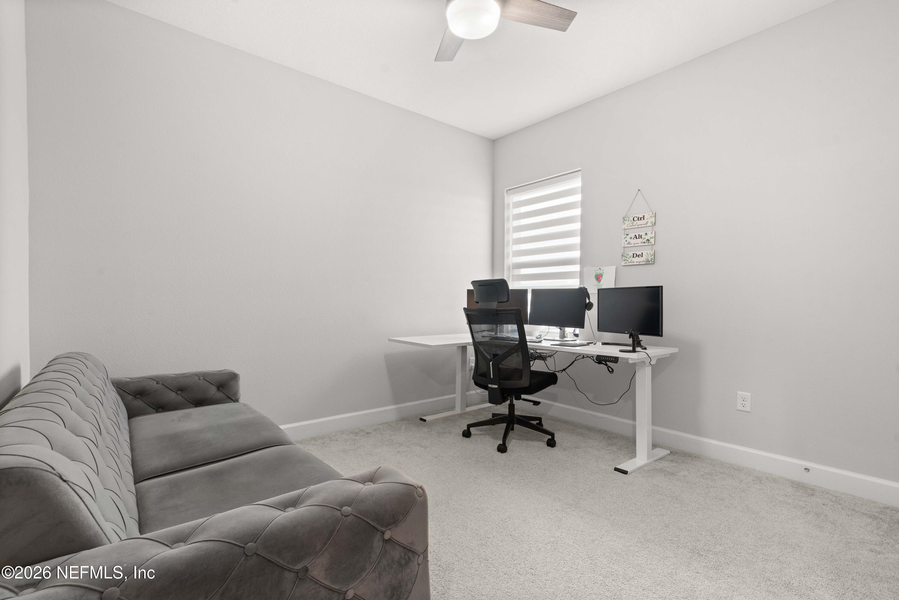 5270 Piney Flats Road Jacksonville, FL 32224 - Photo 32 of 53 a livingroom with workspace and a couch