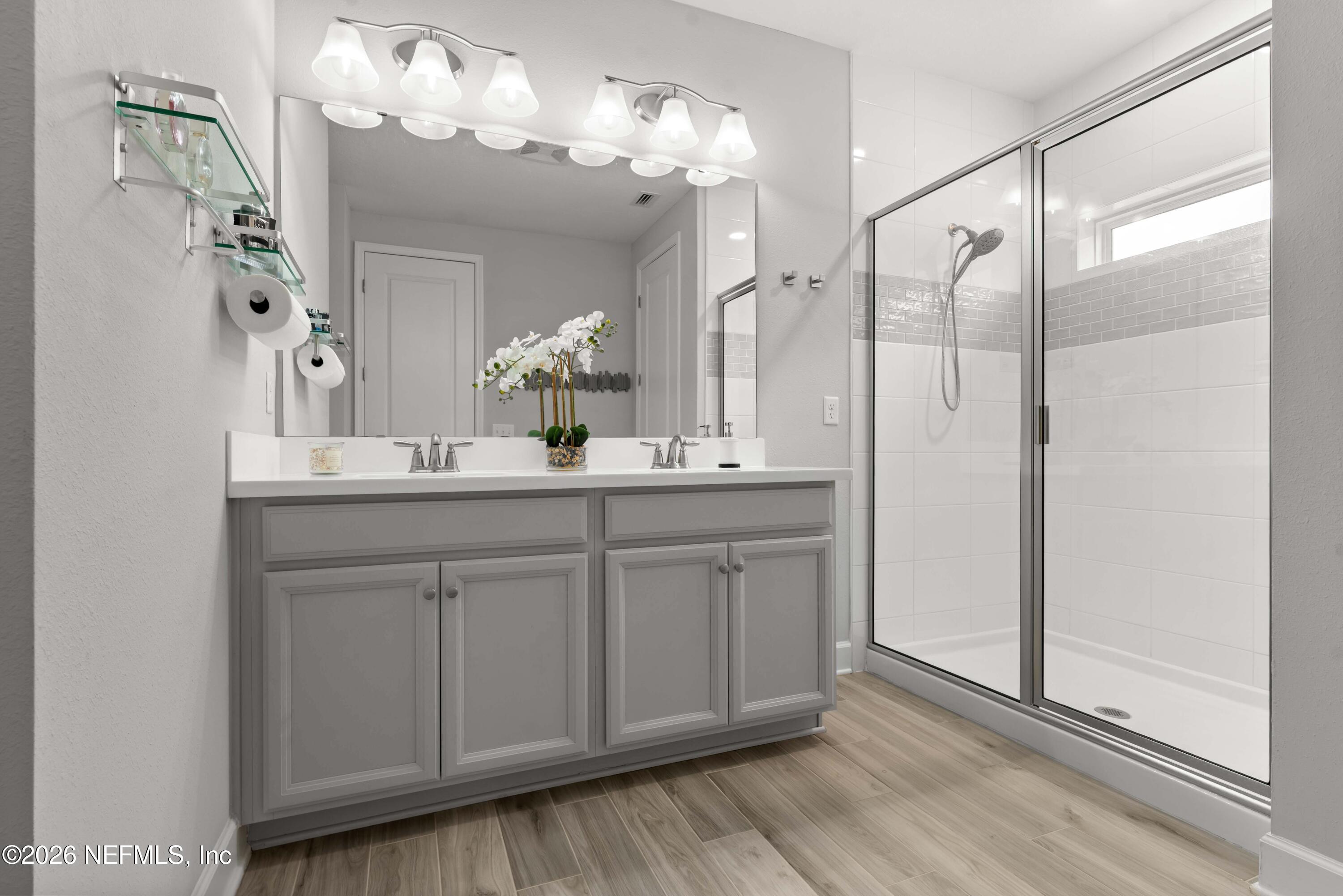 5270 Piney Flats Road Jacksonville, FL 32224 - Photo 33 of 53 a bathroom with a double vanity sink and a mirror