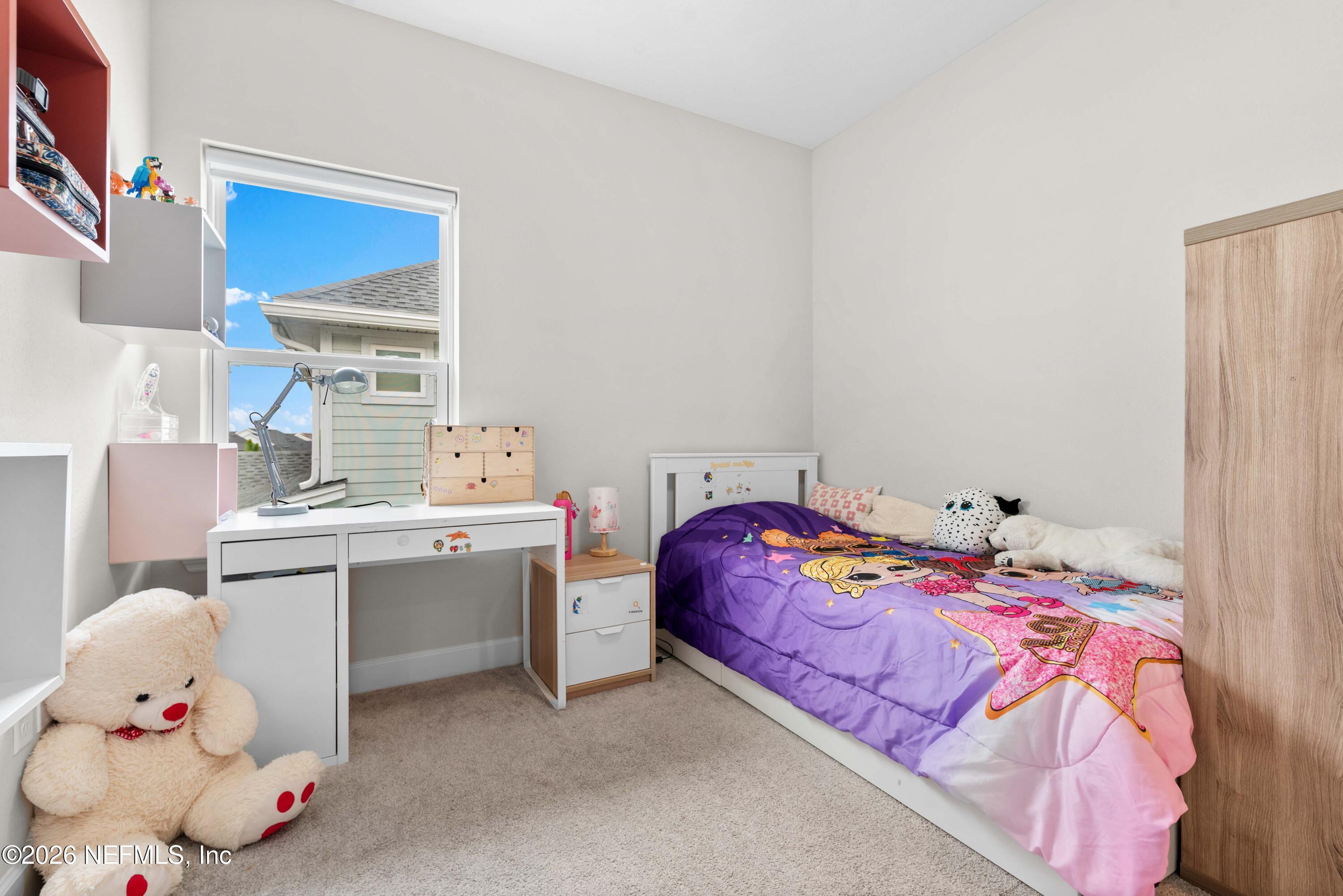 5270 Piney Flats Road Jacksonville, FL 32224 - Photo 34 of 53 a bedroom with a bed and window