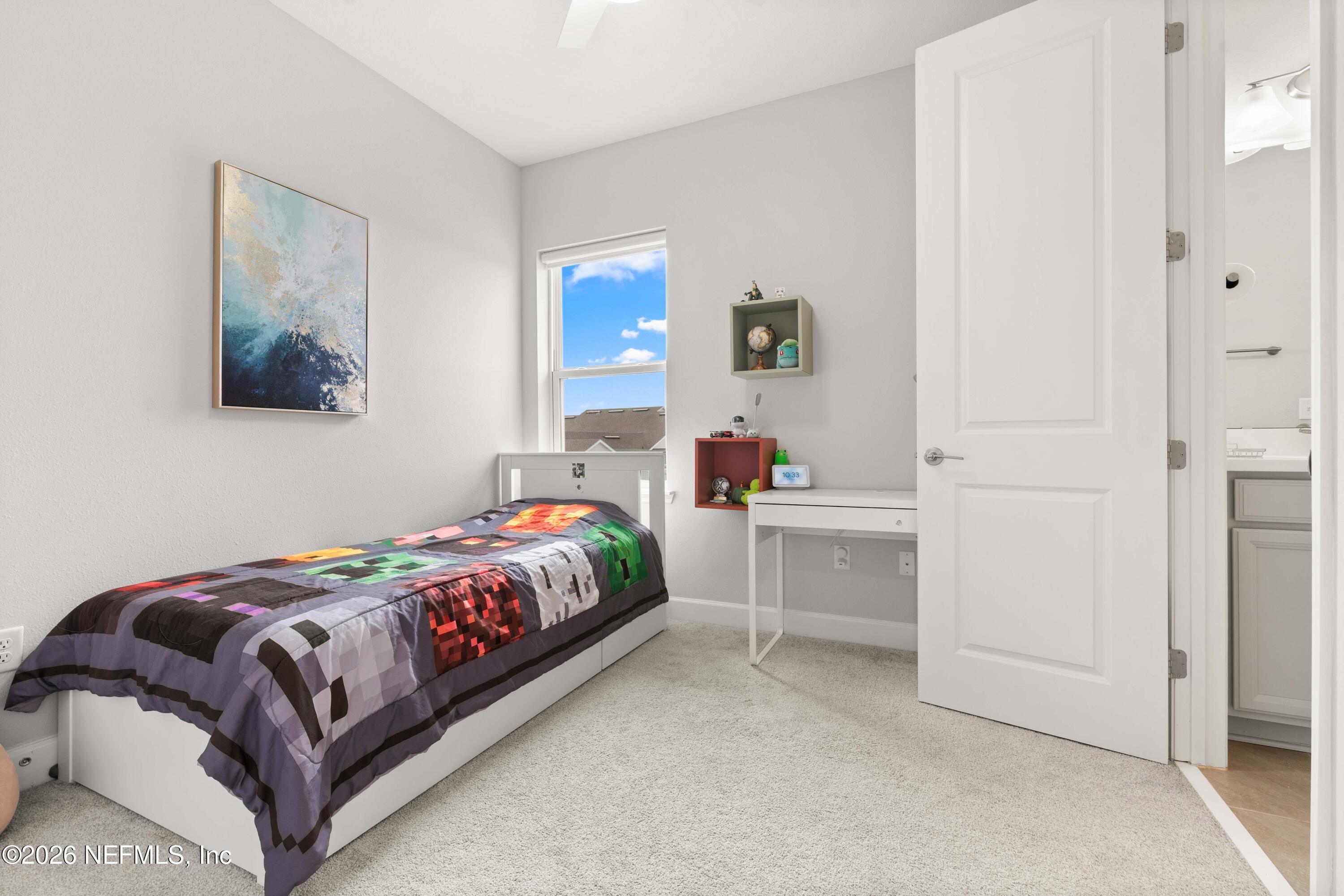 5270 Piney Flats Road Jacksonville, FL 32224 - Photo 37 of 53 a bedroom with a bed and cabinet