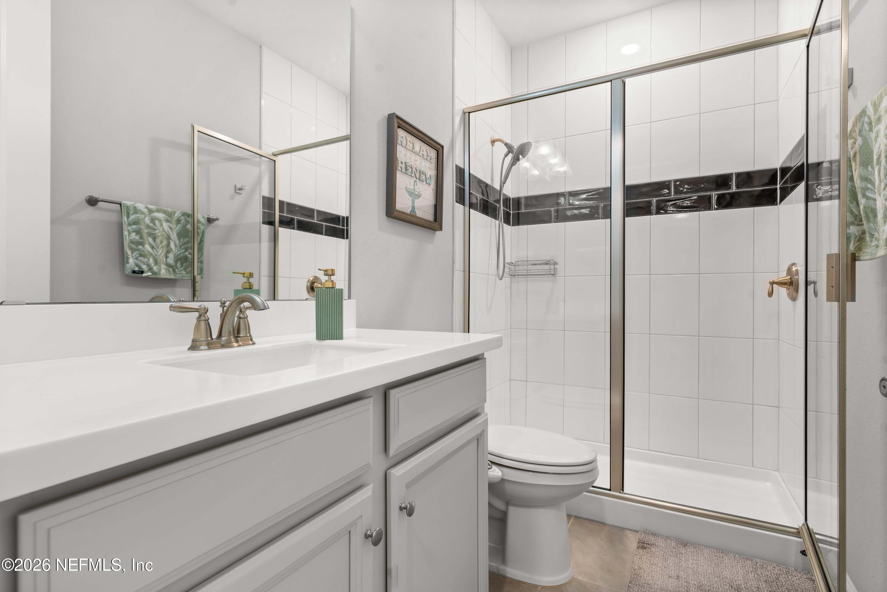 5270 Piney Flats Road Jacksonville, FL 32224 - Photo 38 of 53 a bathroom with a sink a toilet and shower