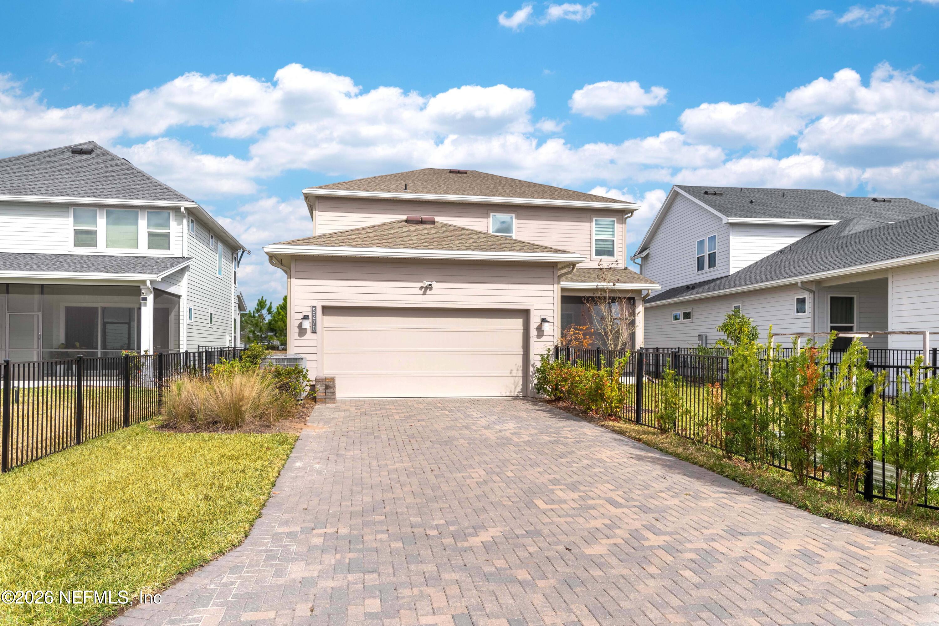 5270 Piney Flats Road Jacksonville, FL 32224 - Photo 49 of 53 a front view of a house with a yard and potted plants