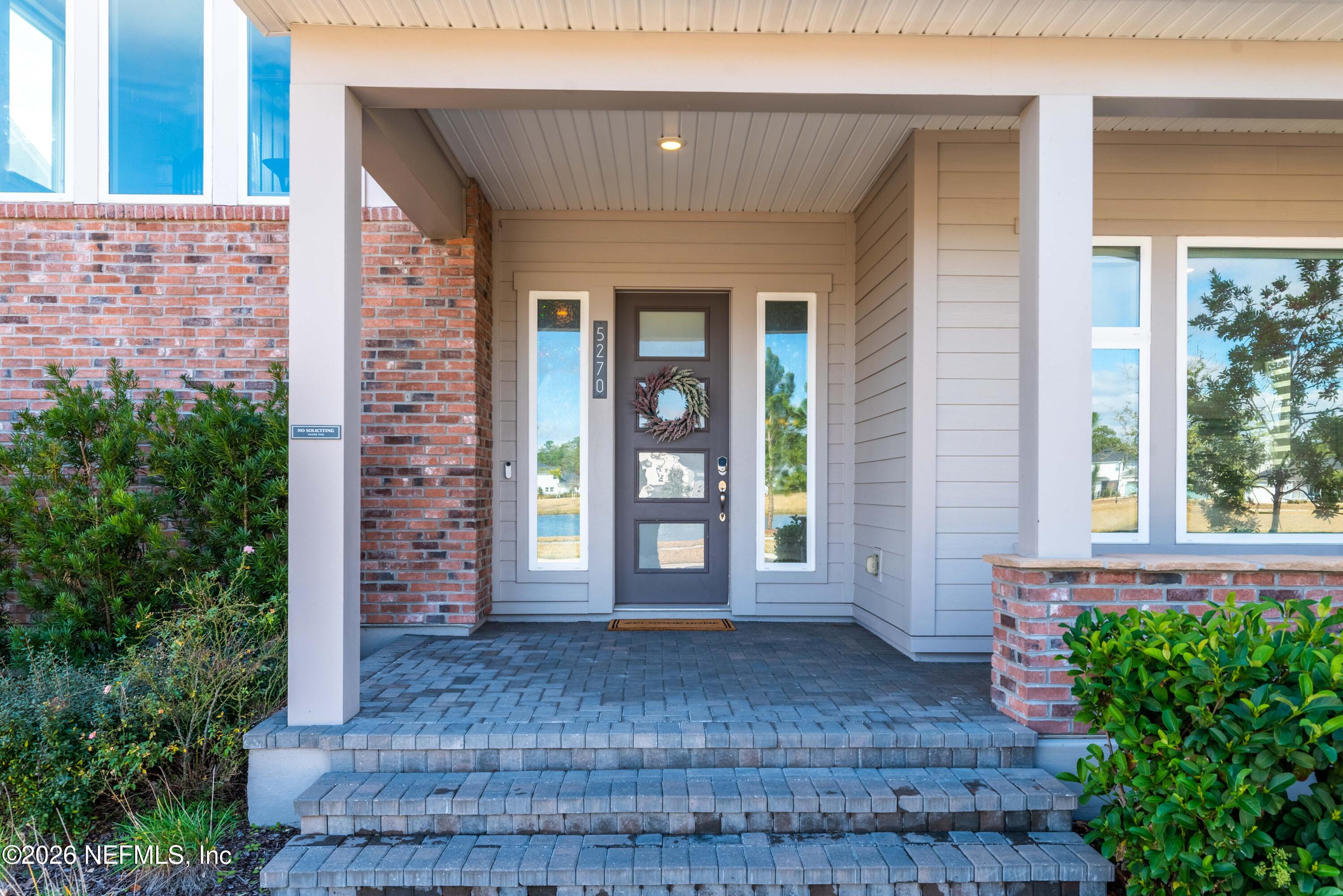 5270 Piney Flats Road Jacksonville, FL 32224 - Photo 7 of 53 front view of a brick house with a large window
