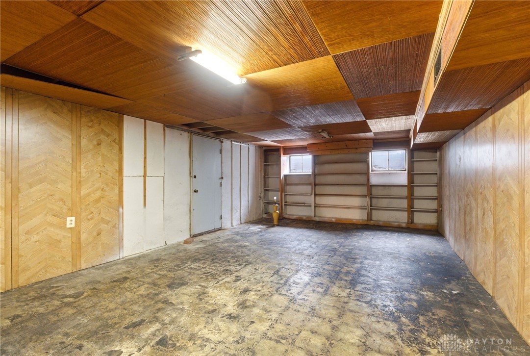2439 Mayfair Road Dayton, OH 45405 - Photo 27 of 41 This spacious area offers potential for conversion, featuring practical built-in shelving and ample natural light.