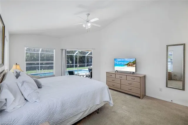 a bed room with a bed and a window