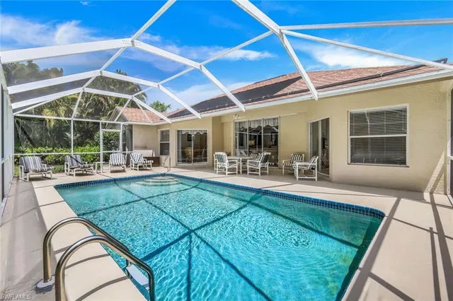 a view of swimming pool with outdoor seating