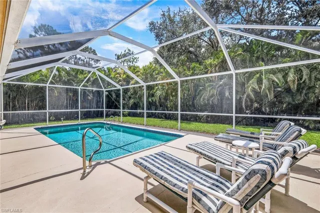 a view of a backyard with sitting area and furniture